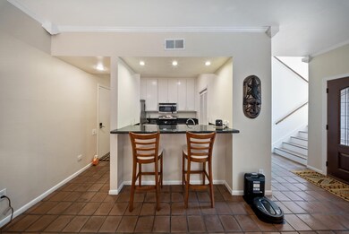 Open-concept layout flows from living to dining, w