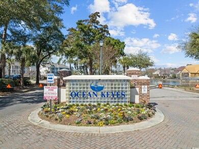 Community / neighborhood sign with a water view