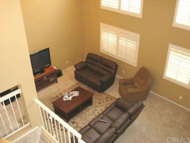 From stair landing panning down to living room.