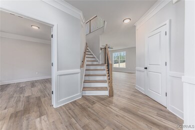 Stairs featuring light hardwood / wood-style floor
