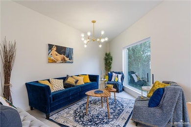 Living room featuring a chandelier