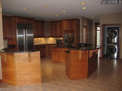 Gorgeous Cherry Kitchen with Stainless Appliances 