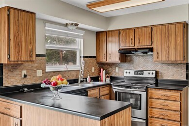 Kitchen features stainless steel appliances and ti