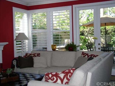 FAMILY ROOM LOOKING OUT TO POOL AREA
