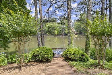 large backyard with lake access for fishing or relaxing on the dock