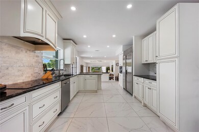 Kitchen: granite countertop & marble back splash