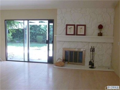 fireplace and slider to rear yard and patio
