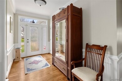 Entrance foyer featuring light hardwood / wood-sty