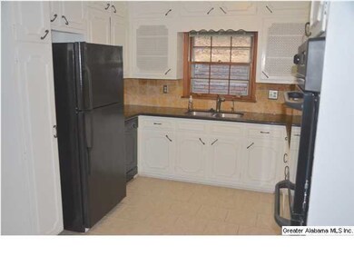 The kitchen comes complete with a side by side ref