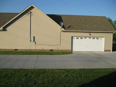 THIS CONCRETE DRIVE PULLS INTO YOUR 2 CAR ATTACHED GARAGE.