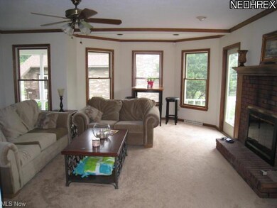 Spacious great room with fireplace and French doors.