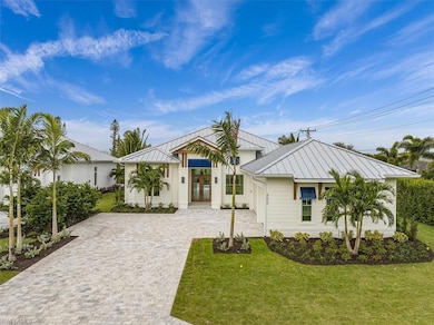 Exterior features include metal roofing, decorativ