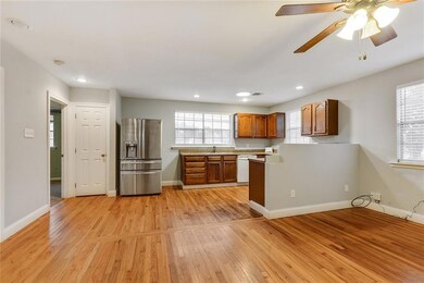 VIEW OF KITCHEN FROM LIVING ROOM PANTRY NEXT TO REFRIGERATOR