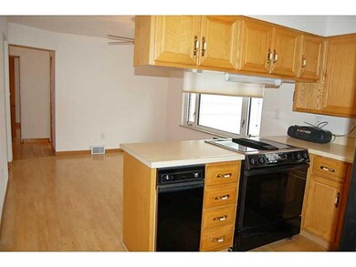 Kitchen. Dining room is adjacent to the kitchen.
