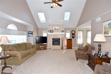 Light filled great room has cathedral ceiling with