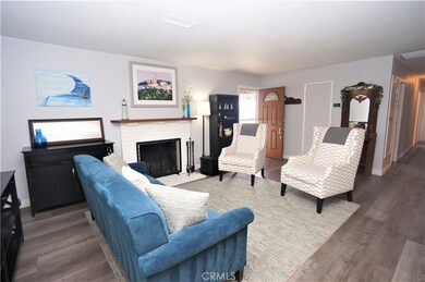 From the dining room entrance towards front door and showing extra chairs for entertaining