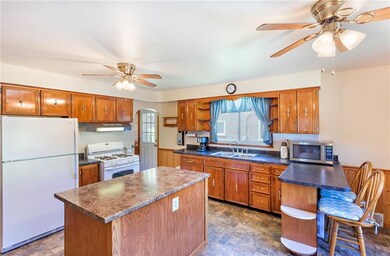 Kitchen/dining room measures 19x15. The island con