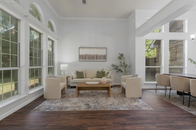 Upon entry, you're greeted with warm, wood-like flooring throughout the entire downstairs.