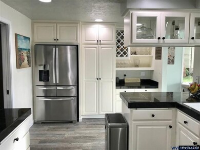 Stainless steel appliances, wall pantry & desk are