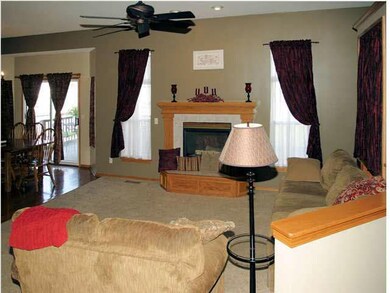 View of open formal living room with gas fire-plac