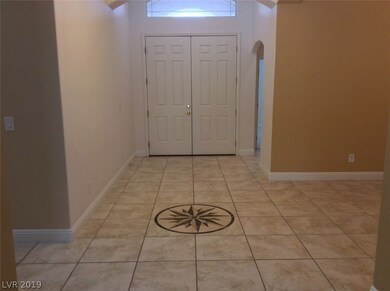 Beautiful tiled entry, large double doors to welco