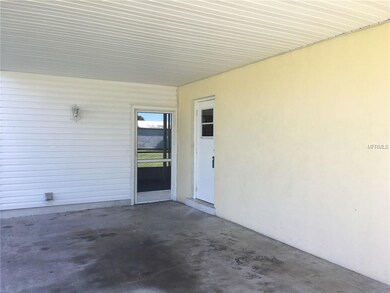 Carport and side entrance to home and entrance to 