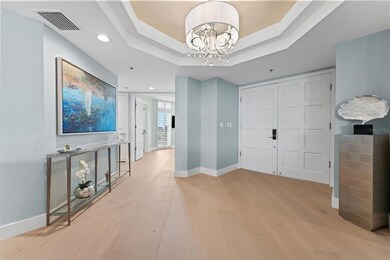 Beautiful Grand Entrance With Double Doors and Tray Ceiling