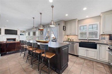 Newly remodeled kitchen features a large island fo