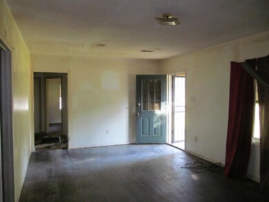 Spare room featuring wood-type flooring