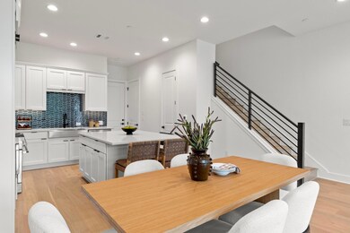 Dining room with visible vents, light wood-style 