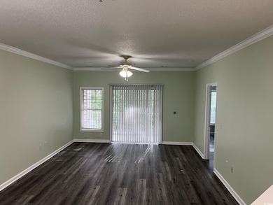 Spare room featuring baseboards, a ceiling fan, a 