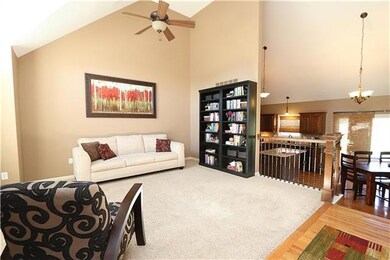 Formal living room with view to kitchen that could