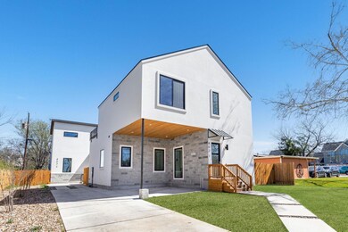 View of front facade featuring stucco siding and 