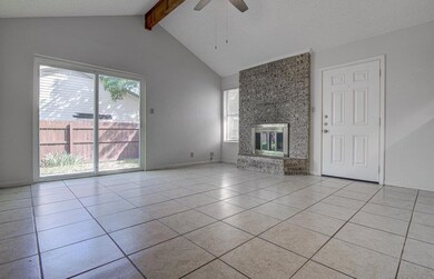Unfurnished living room with a ceiling fan, light