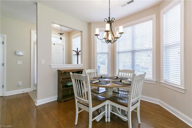 Bay window streams natural light in this dining room
