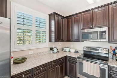 Kitchen featuring stainless steel appliances, ligh