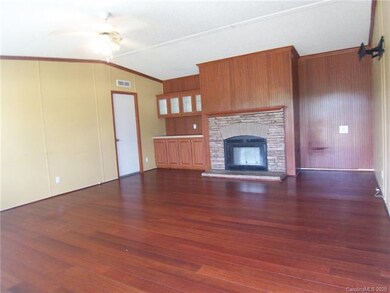 Living Room has a fireplace and built-ins.