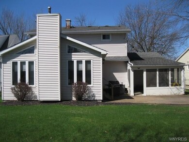 Rear of home shows off the family room addition, s