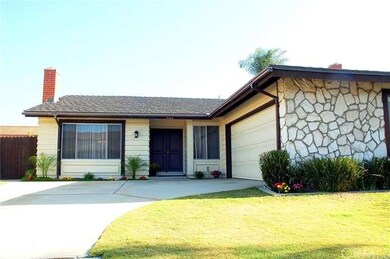 Freshly landscaped front yard!  Note the extra wide driveway and RV gates.  Room for a small RV or boat, to slide behind the gates. 