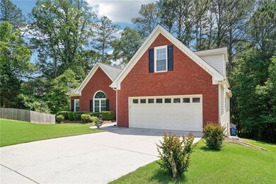 Traditional-style house featuring concrete drivewa