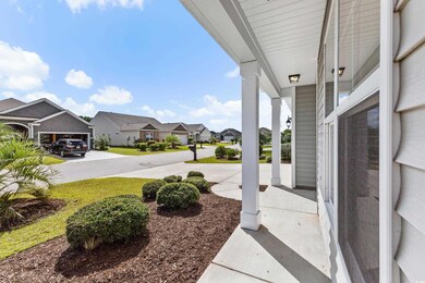 View of yard with covered porch