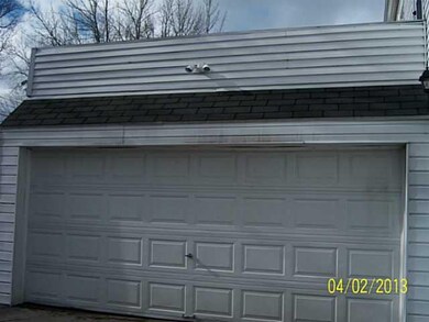 Exterior Back 2 CAR DRYWALLED GARAGE WITH OPEN BAL