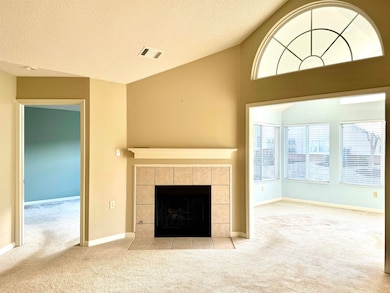 Unfurnished living room featuring visible vents, a