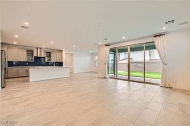 Kitchen with open floor plan, gray cabinets, stain
