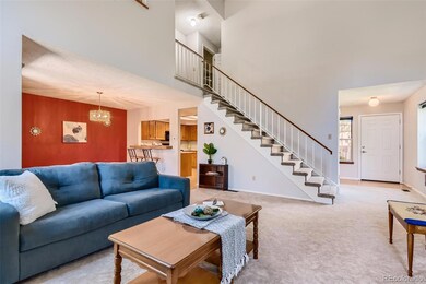 View of dining room and kitchen from the fireplace