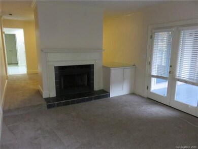 Living Room Fireplace and Adjacent Entry to Balcon