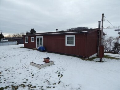 Double Doors lead from kitchen area to Rear Yard