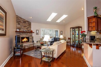Greatroom with vaulted ceiling, skylights & recess
