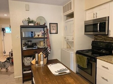 Convenient stacked washer and dryer in kitchen for