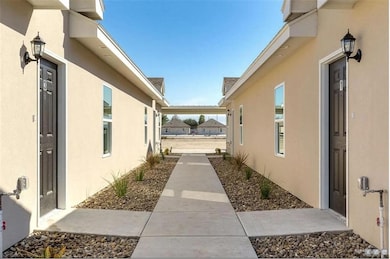 View of side of home featuring stucco siding